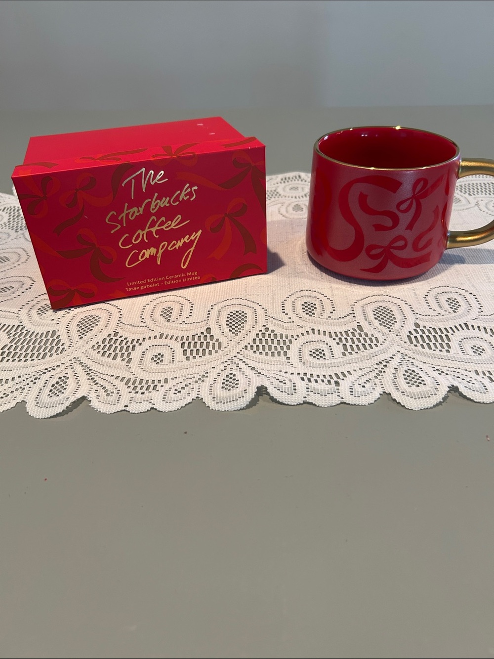 Starbucks Red Ceramic Mug with Gold Handle and Ribbon Motif